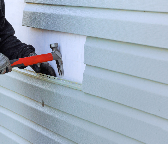 siding repair charlotte nc contractor fixing home siding.
